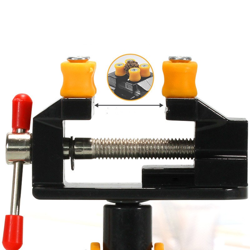 Close-up of the vise jaws with orange caps and the red-tipped T-handle; inset shows a small piece held between the caps