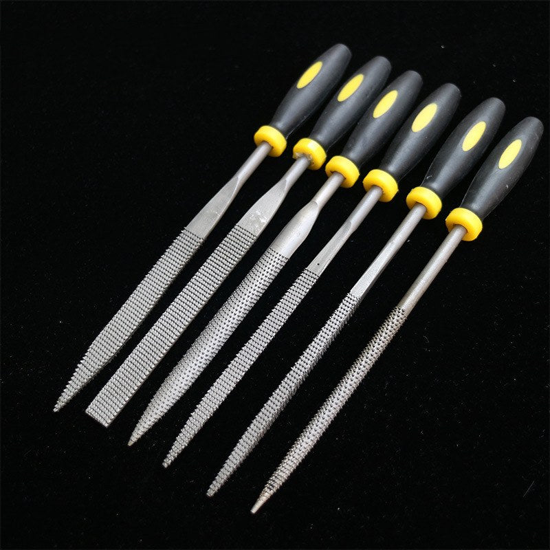 Six steel needle files with black and yellow grips fanned out on black velvet, showing six different shapes