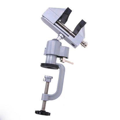 Table vise head tilted on its ball joint above the bench clamp, with the jaws turned at an angle